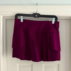 Athleta size small, plum colored, tennis skirt.